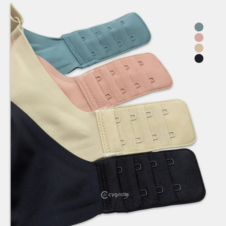 Imagem destacando as diferentes cores do Sutiã Alça Fina Cygnuss – verde, rose, nude e preto – com detalhe no fecho ajustável para maior conforto.