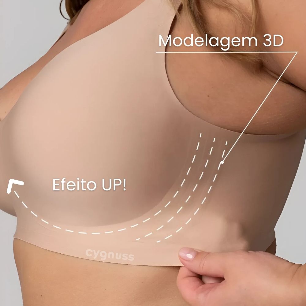 Imagem em close do Sutiã Premium Reforçado Cygnuss na cor bege, com modelo segurando o tecido para demonstrar a suavidade e elasticidade do material.