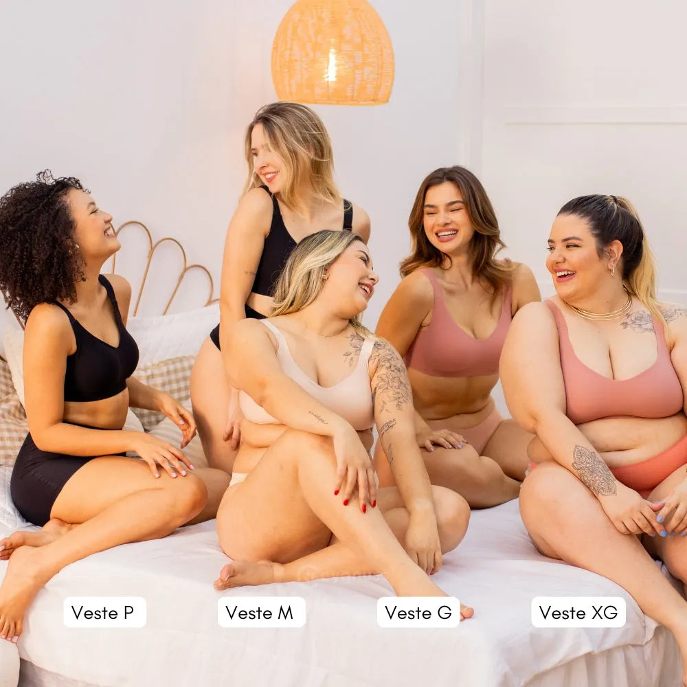 Cinco mulheres de diferentes biotipos vestindo o Sutiã Premium Reforçado Cygnuss em cores variadas. A imagem destaca tamanhos disponíveis: P, M, G e XG.