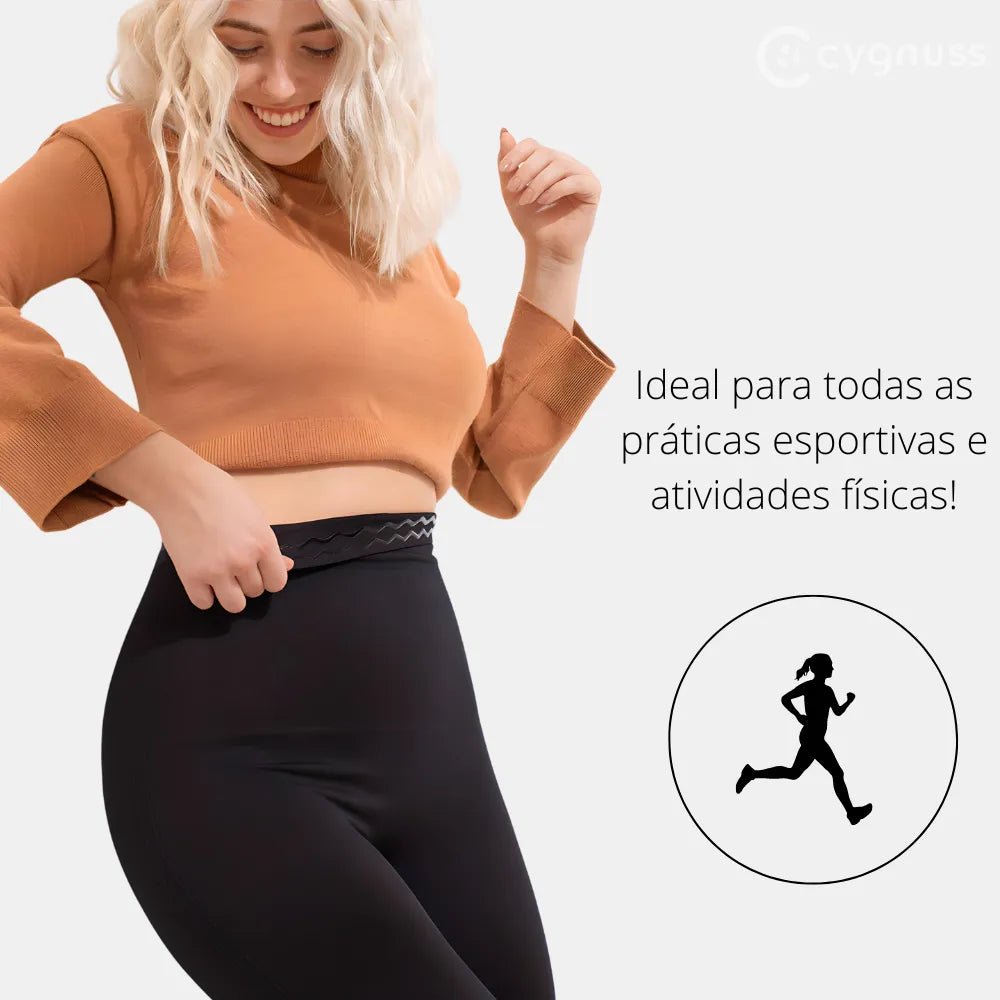 Mulher usando a Legging Jade Fit Modeladora de Cós Alto na cor preta, combinada com cropped laranja, destacando o cós anatômico e o ajuste perfeito. A legenda ao lado destaca: "Ideal para todas as práticas esportivas e atividades físicas!" com ícone de corrida.

