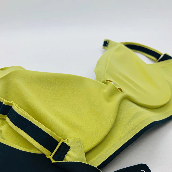 Detalhes Sutiã Cygnuss com cygel ajustáveis e fecho e bojos remov                        íveis preto e verde