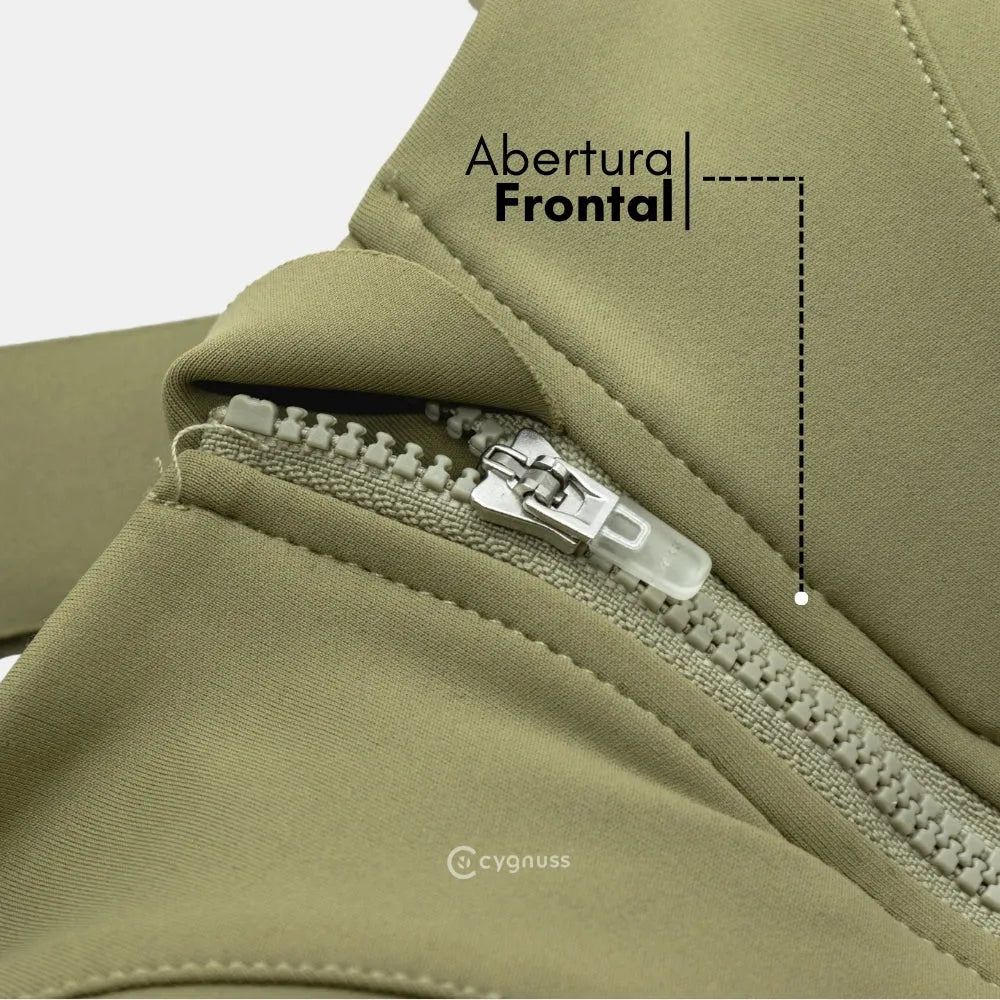 Close-up do fecho frontal do sutiã esportivo Cygnuss na cor verde, destacando o zíper resistente com aba protetora para maior conforto e praticidade ao vestir.
