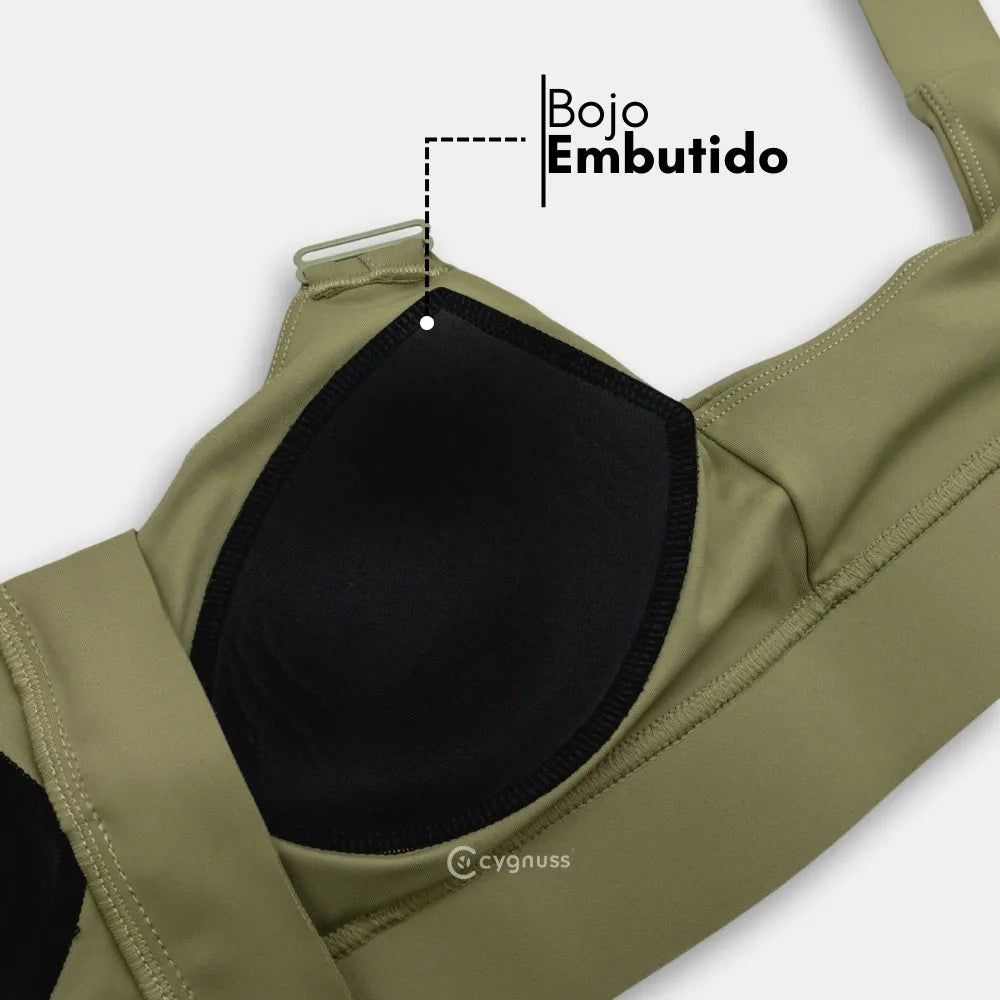 Detalhe do sutiã esportivo Cygnuss na cor verde, destacando o bojo embutido para melhor sustentação e conforto durante o uso.