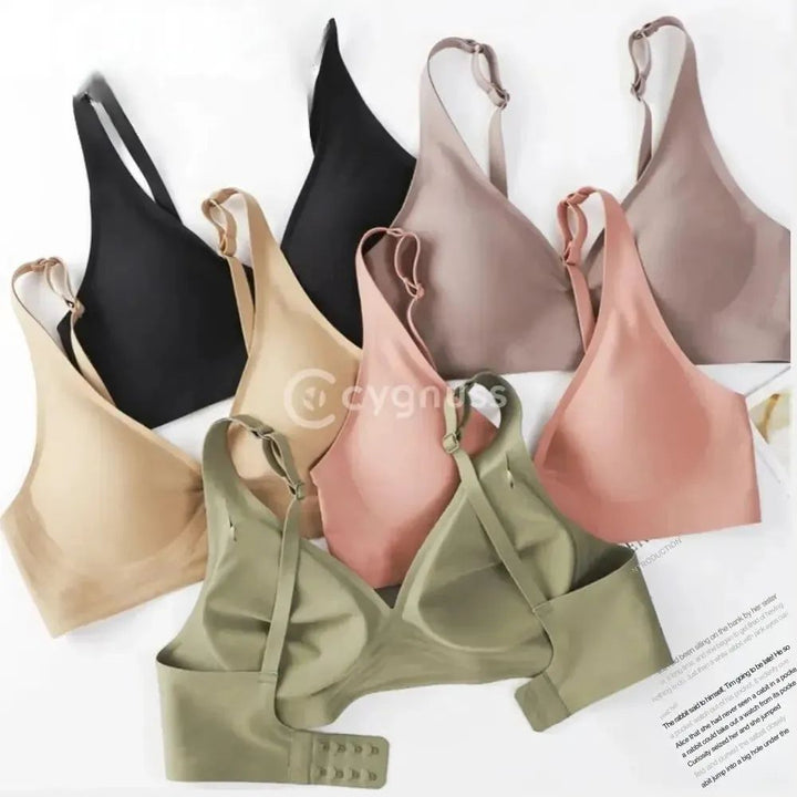 Variação completa do Sutiã FIT em várias cores — preto, bege, rosé, verde oliva e marrom. A imagem mostra modelos com vista frontal e traseira, destacando alças finas ajustáveis, bojo removível e fecho com quatro níveis.